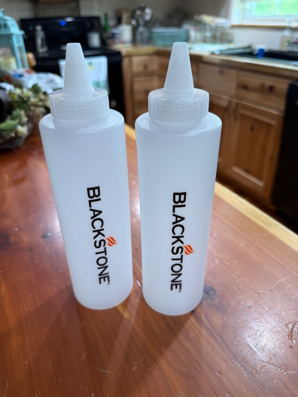 2 Black Stone plastic squirt bottles